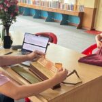 BDRC Head Librarian digitizing texts at Namdroling Monastery.