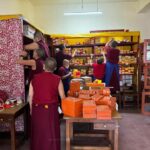 Librarians at Shugseb Nunnery, India, organize their collection of Buddhist texts.