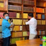 BDRC Head Librarian helps organize the library at Geden Choeling Nunnery.