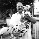 Gene Smith with his pet dogs in India, 1970s